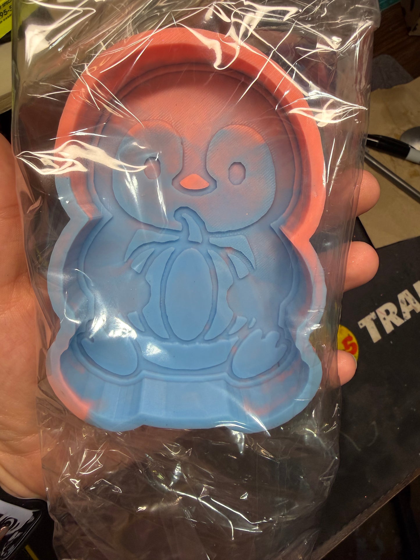 RTS - penguin holding pumpkin