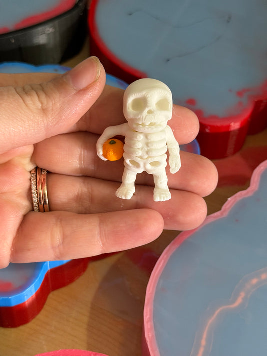 Articulated Skull Holding Pumpkin